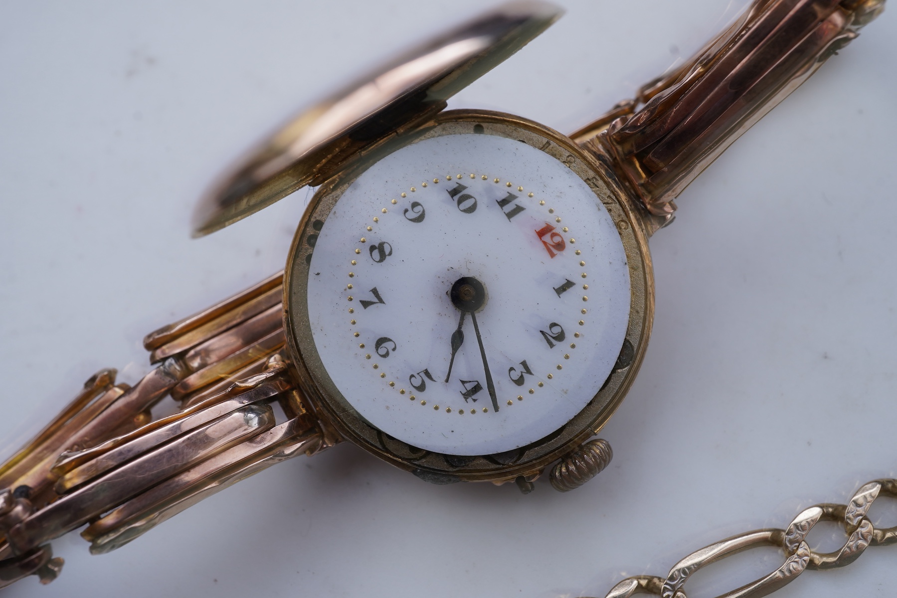 Two gold bracelets and a gold watch
